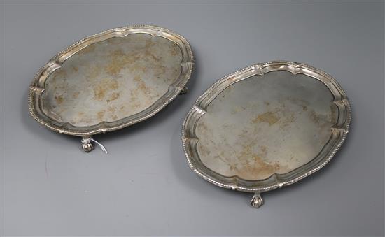 A pair of George III oval silver teapot stands, John Schofield, London, 1778, 17 oz.